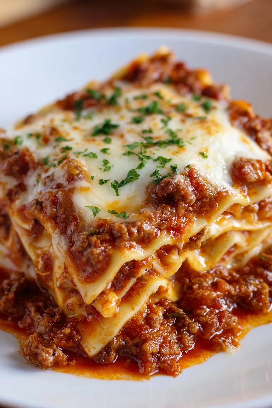 crockpot lasagna, cheesy layers, savory sauce, slow-cooked perfection
